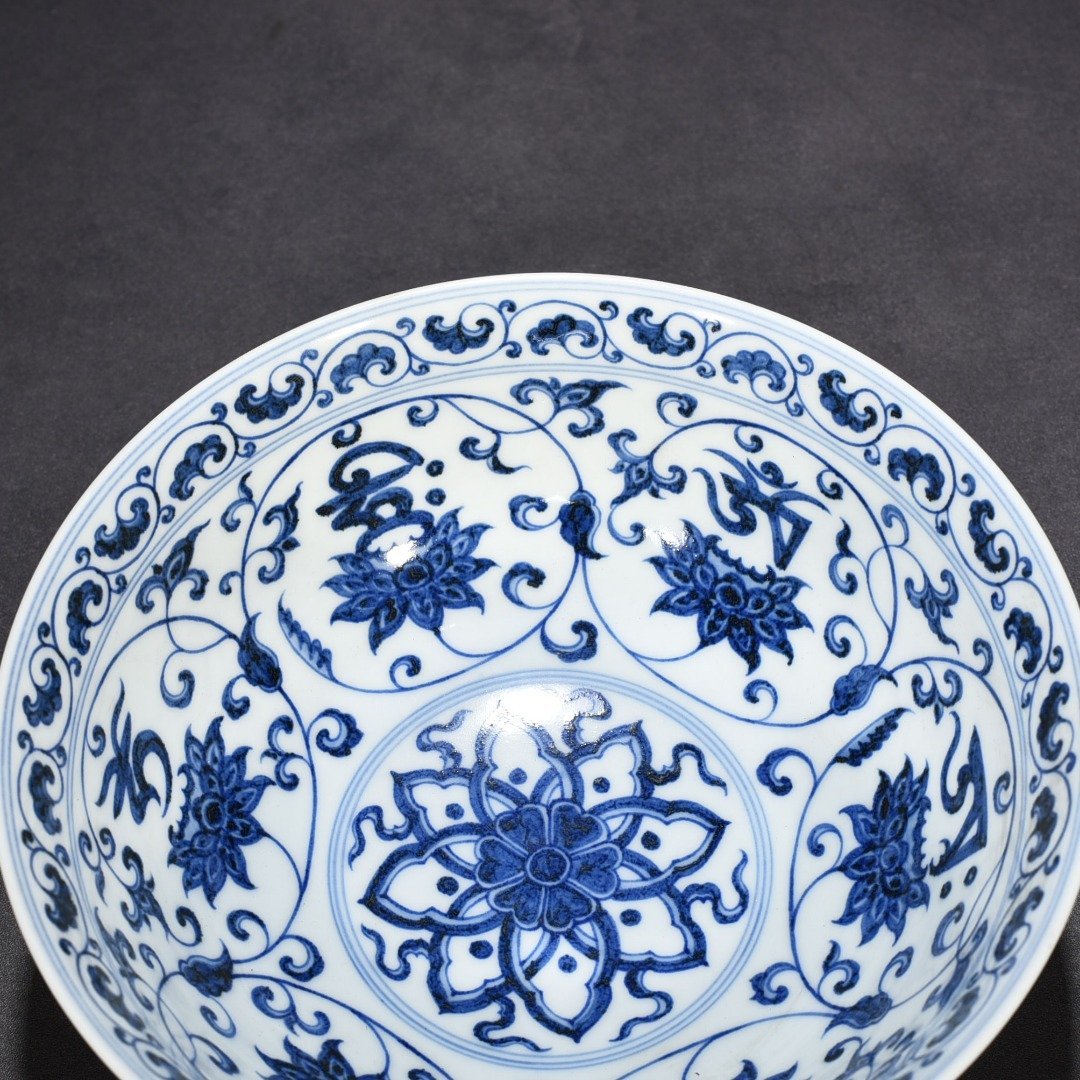 Ming Dynasty Xuande blue and white lotus bowl with Sanskrit holder