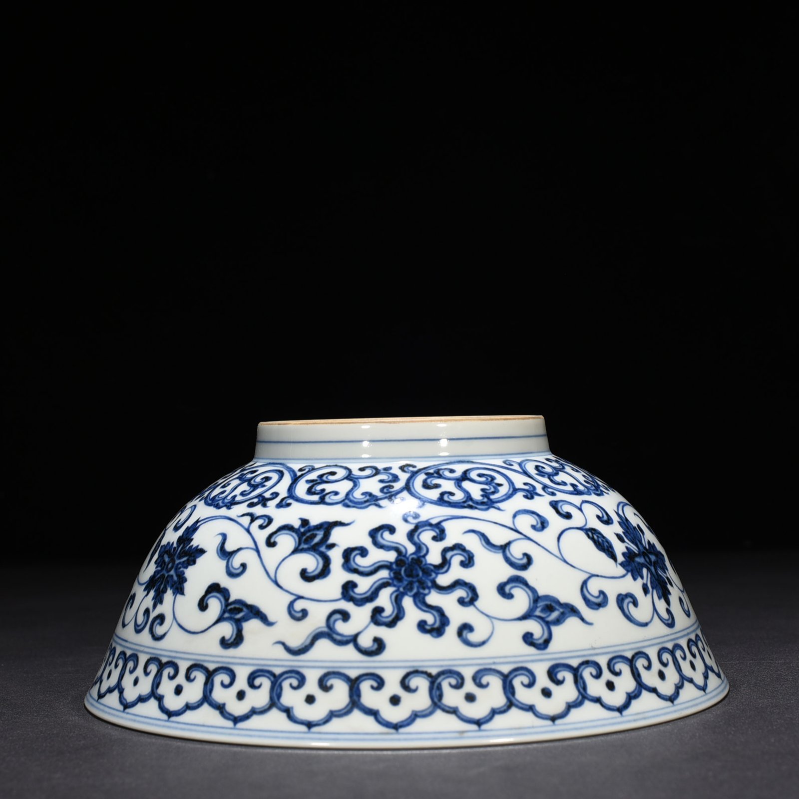 Ming Dynasty Xuande blue and white lotus bowl with Sanskrit holder