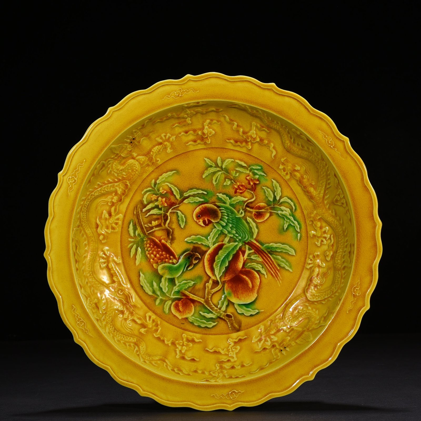 Ming Dynasty Hongzhi delicate yellow glaze carved folding branch flower and bird plate