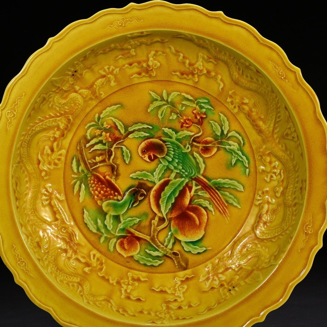 Ming Dynasty Hongzhi delicate yellow glaze carved folding branch flower and bird plate