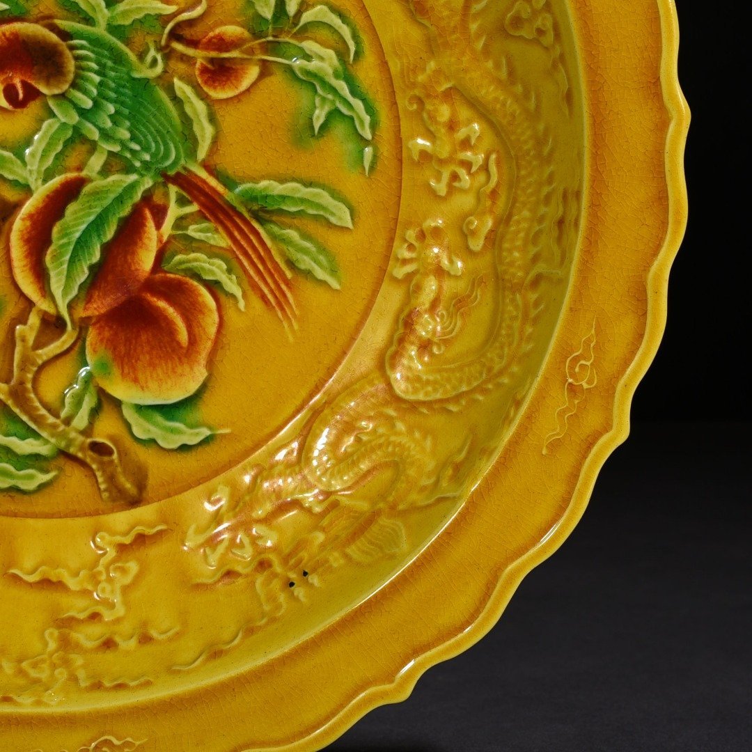 Ming Dynasty Hongzhi delicate yellow glaze carved folding branch flower and bird plate