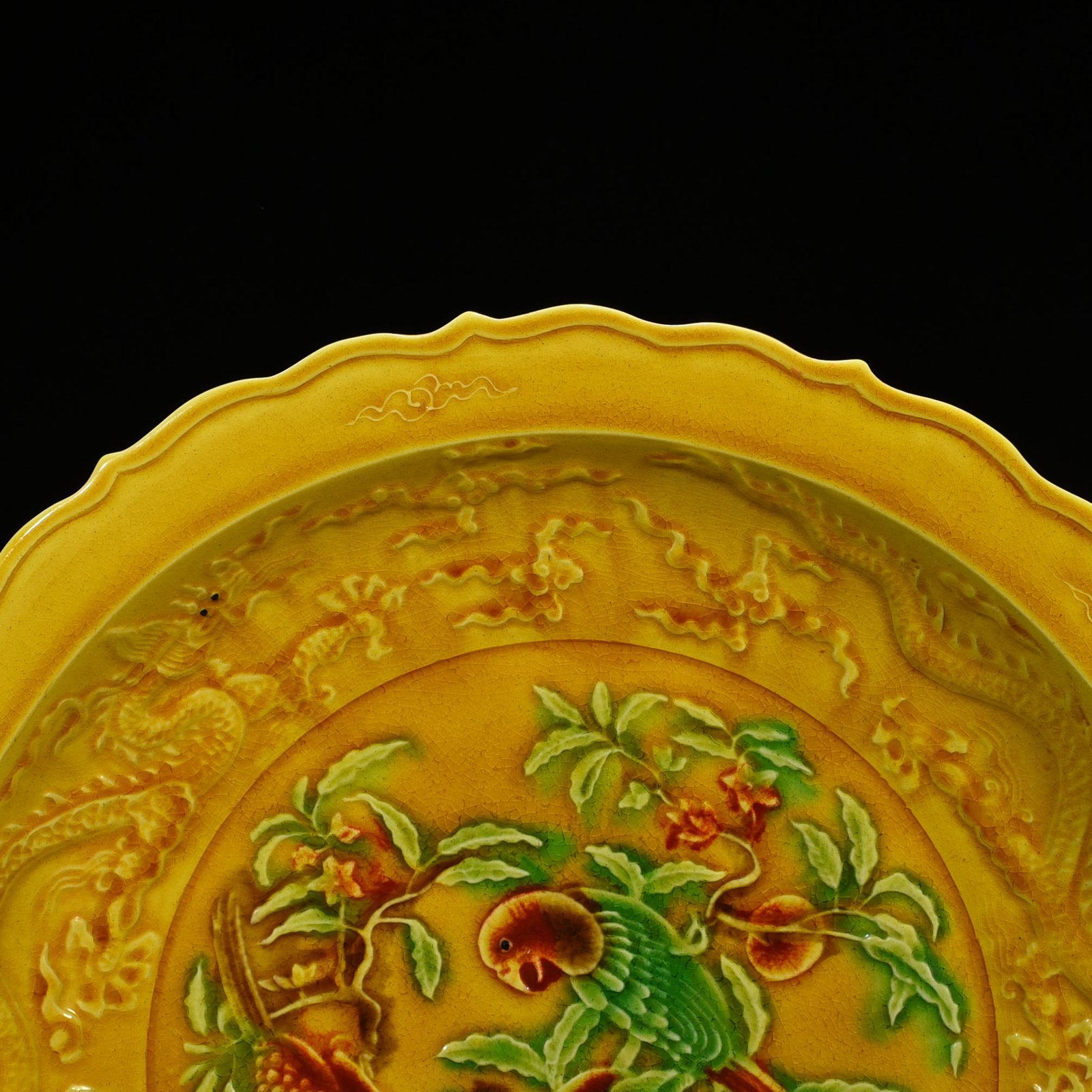 Ming Dynasty Hongzhi delicate yellow glaze carved folding branch flower and bird plate