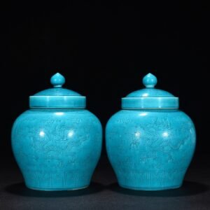 Ming Dynasty Hongzhi peacock blue glaze engraved cloud and dragon pattern lid jar