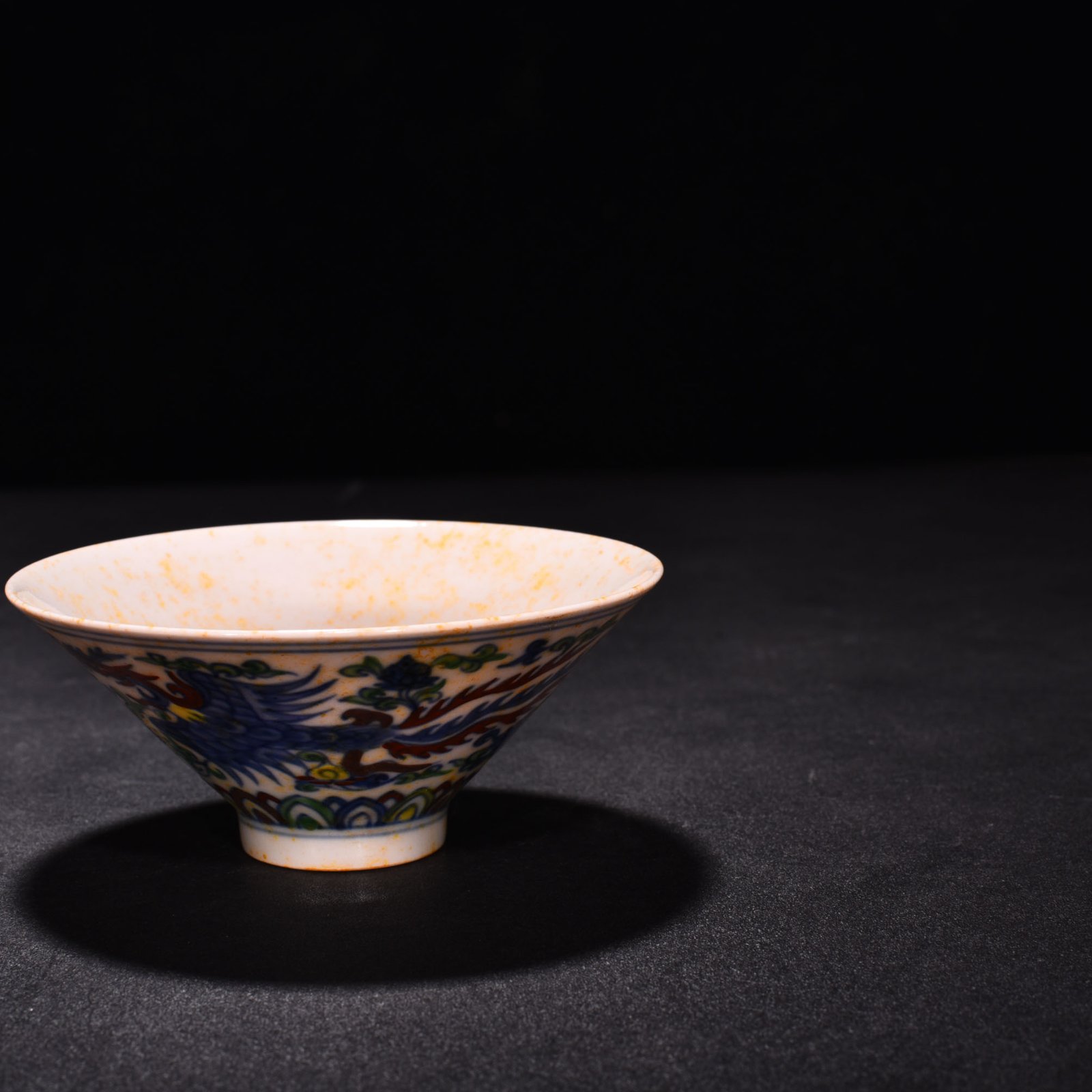Ming Dynasty Chenghua red-bodied bucket hat with colorful purple peacock