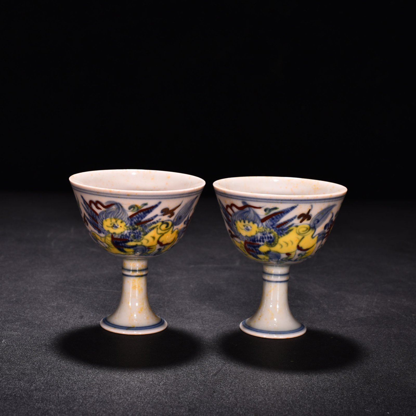 Ming Dynasty Chenghua red body cup with colorful purple sea beasts