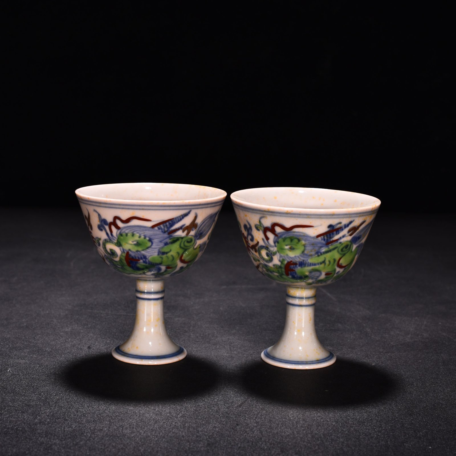 Ming Dynasty Chenghua red body cup with colorful purple sea beasts