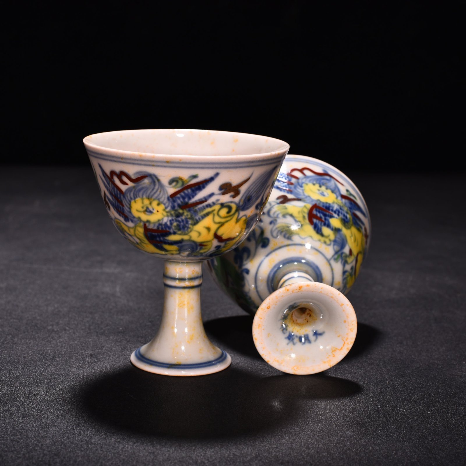 Ming Dynasty Chenghua red body cup with colorful purple sea beasts