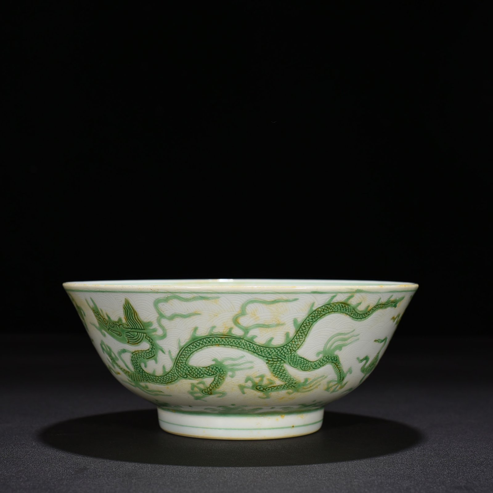 Ming Dynasty Chenghua carved seawater green dragon bowl