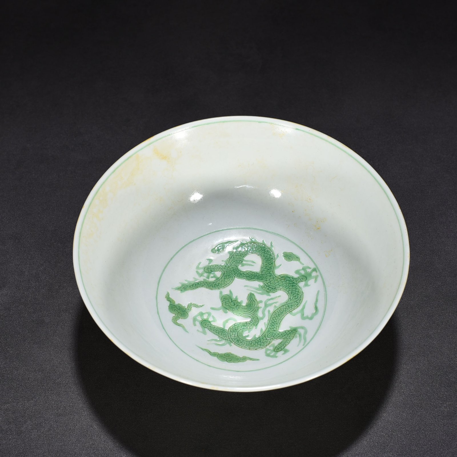 Ming Dynasty Chenghua carved seawater green dragon bowl