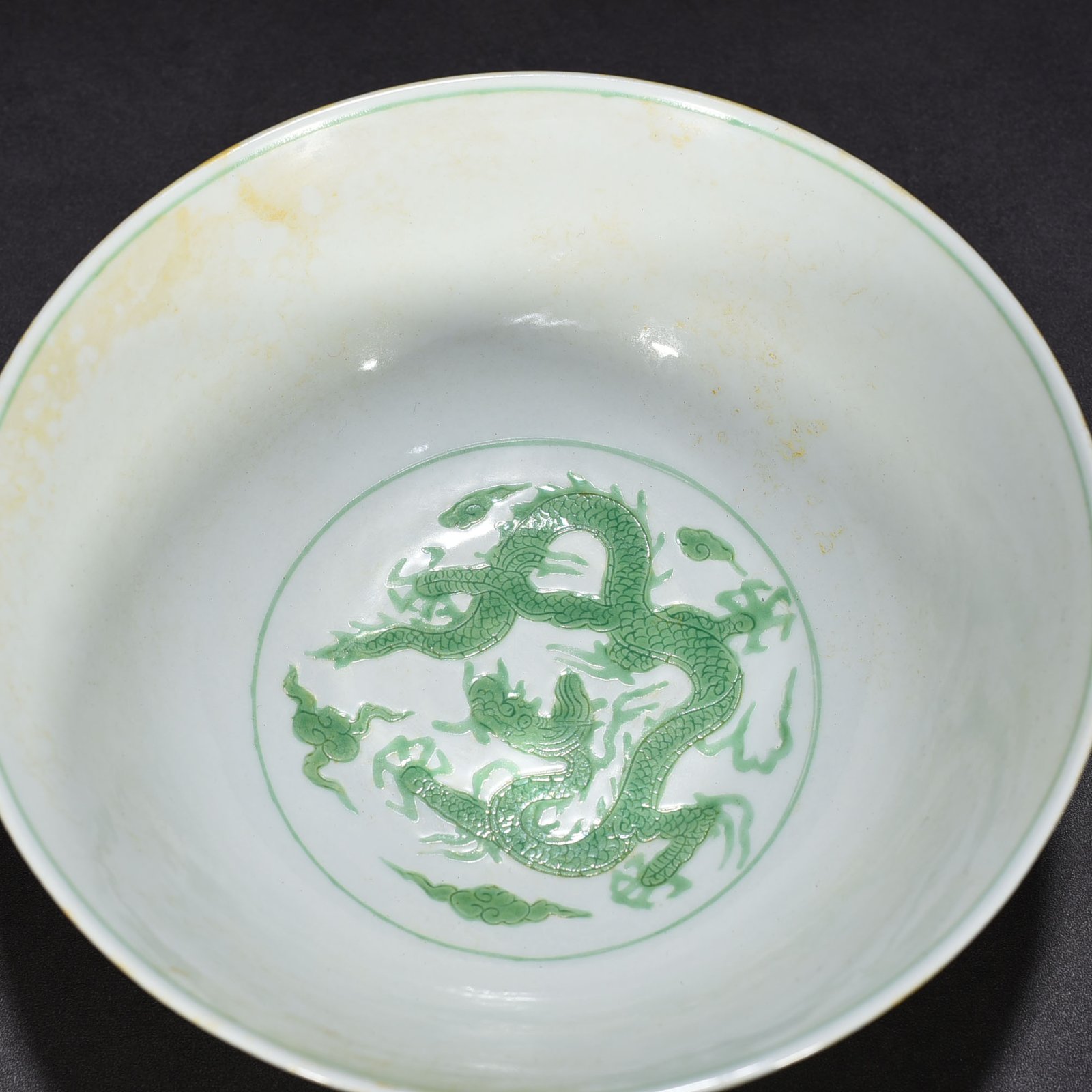 Ming Dynasty Chenghua carved seawater green dragon bowl