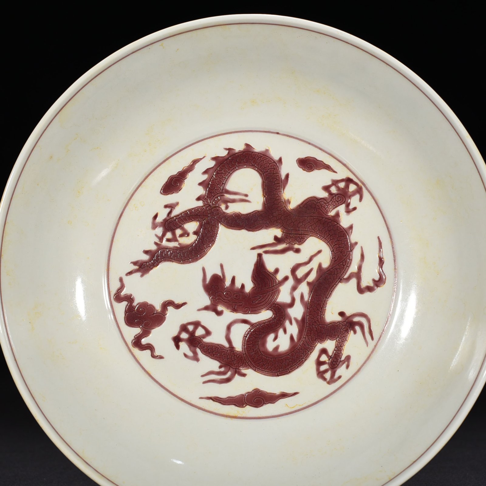 Ming Dynasty Chenghua carved purple dragon plate