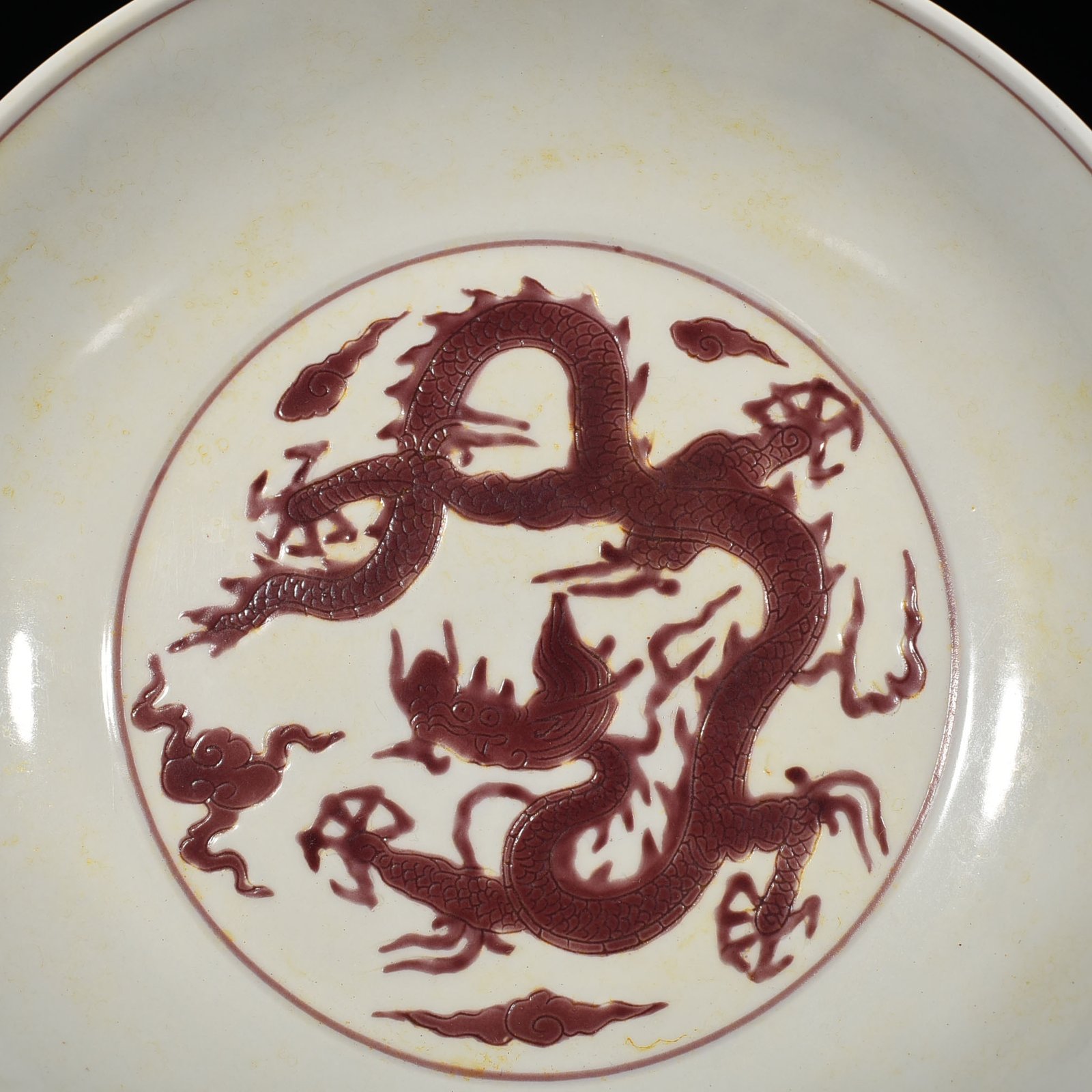 Ming Dynasty Chenghua carved purple dragon plate