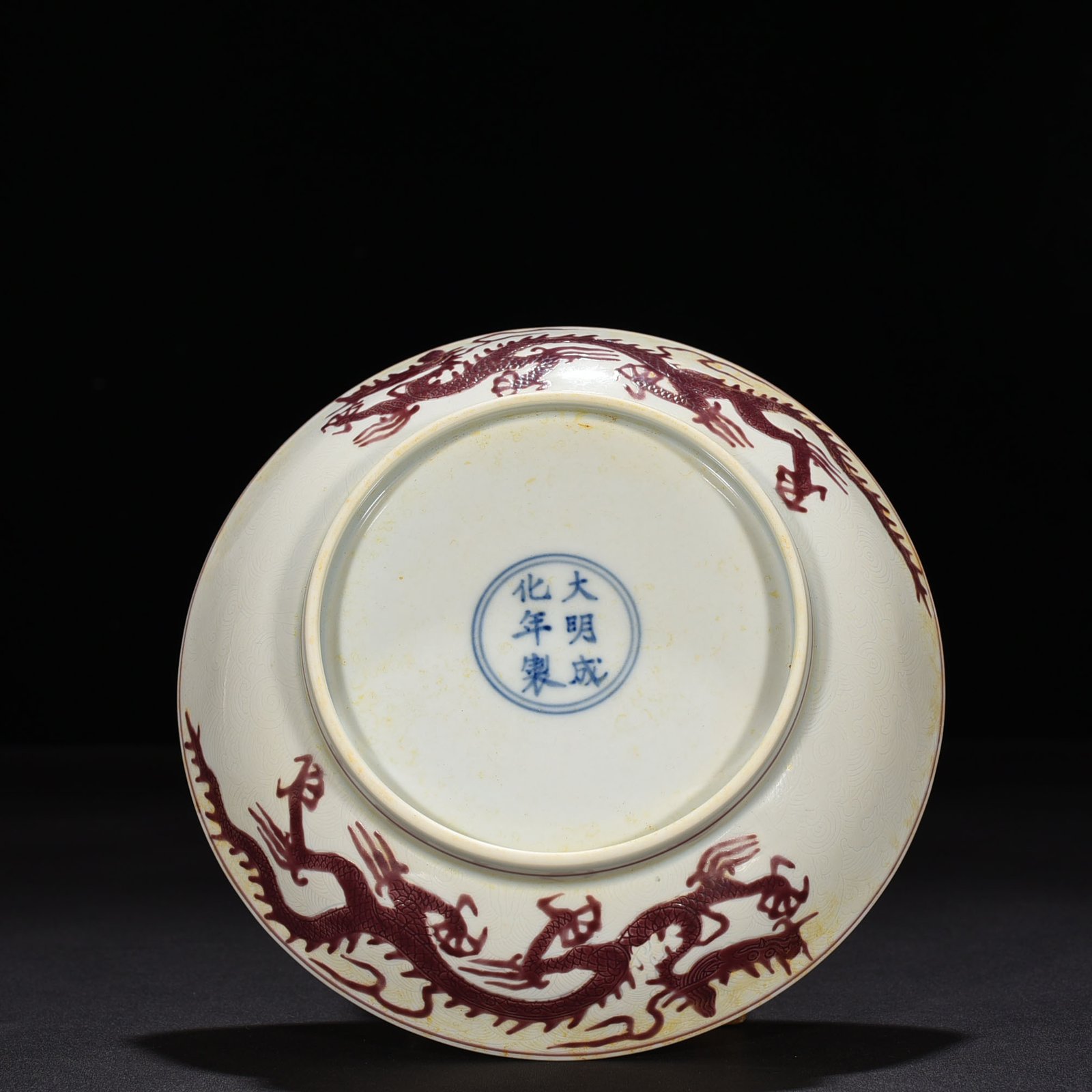 Ming Dynasty Chenghua carved purple dragon plate