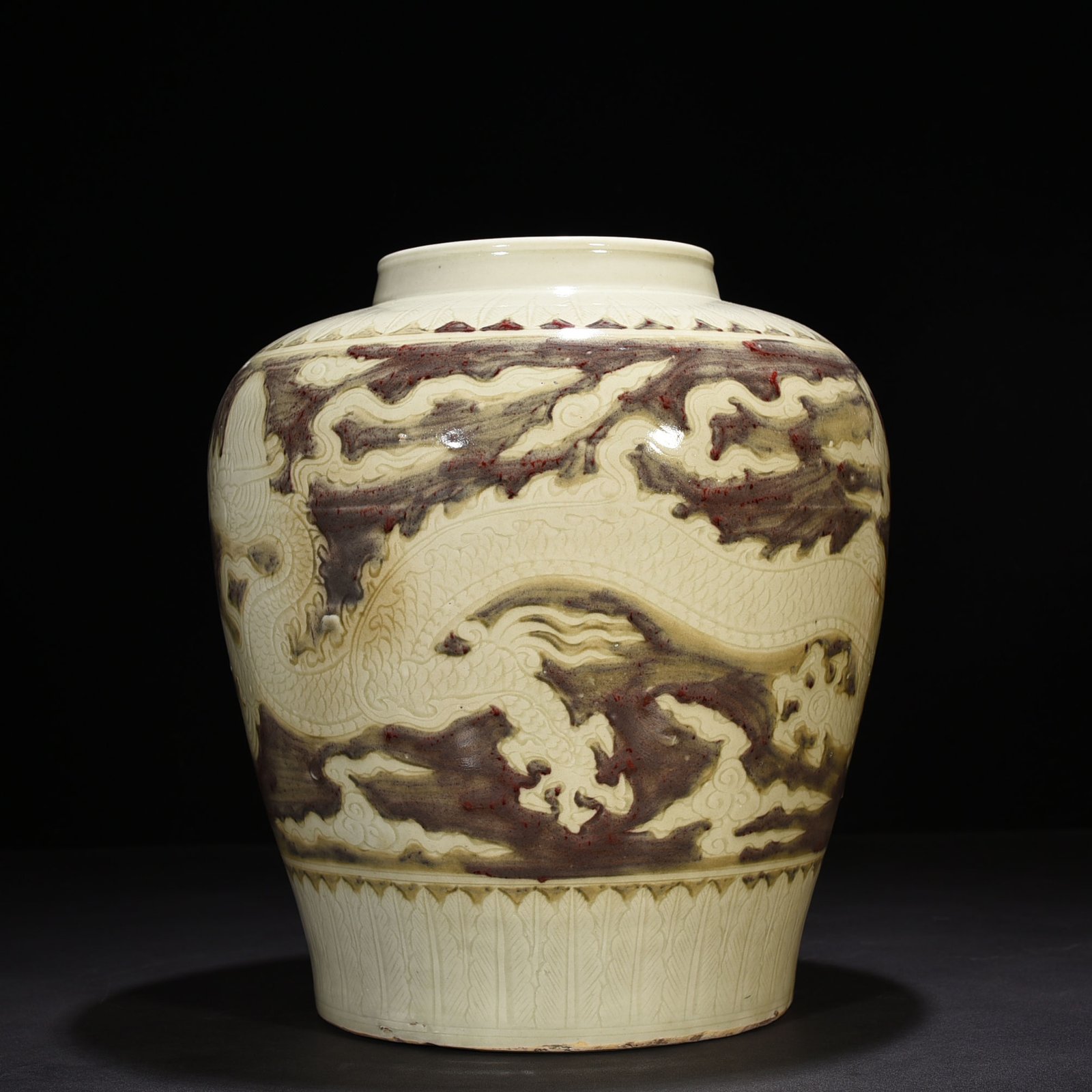 Ming Dynasty Yongle underglaze red carved dragon jar