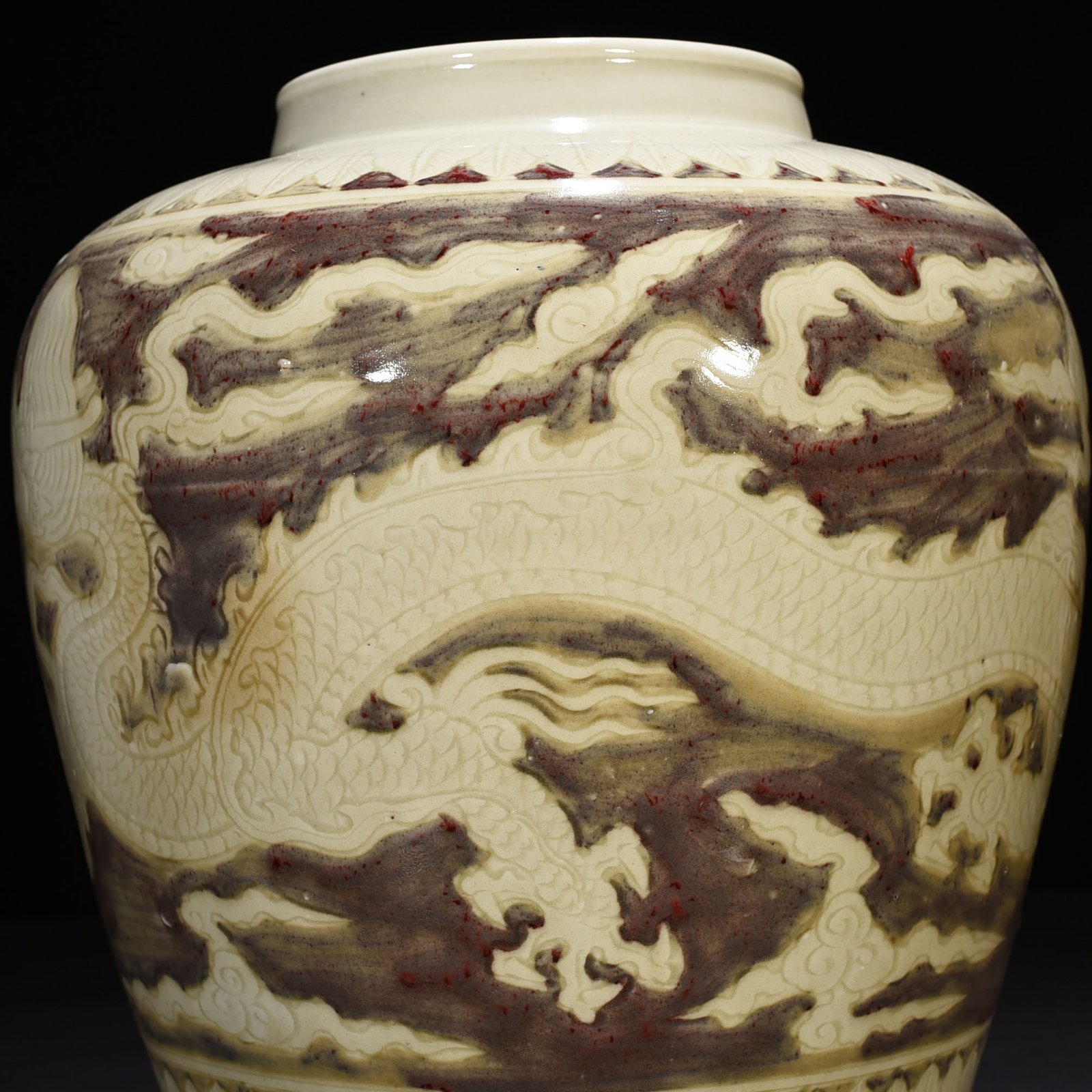 Ming Dynasty Yongle underglaze red carved dragon jar
