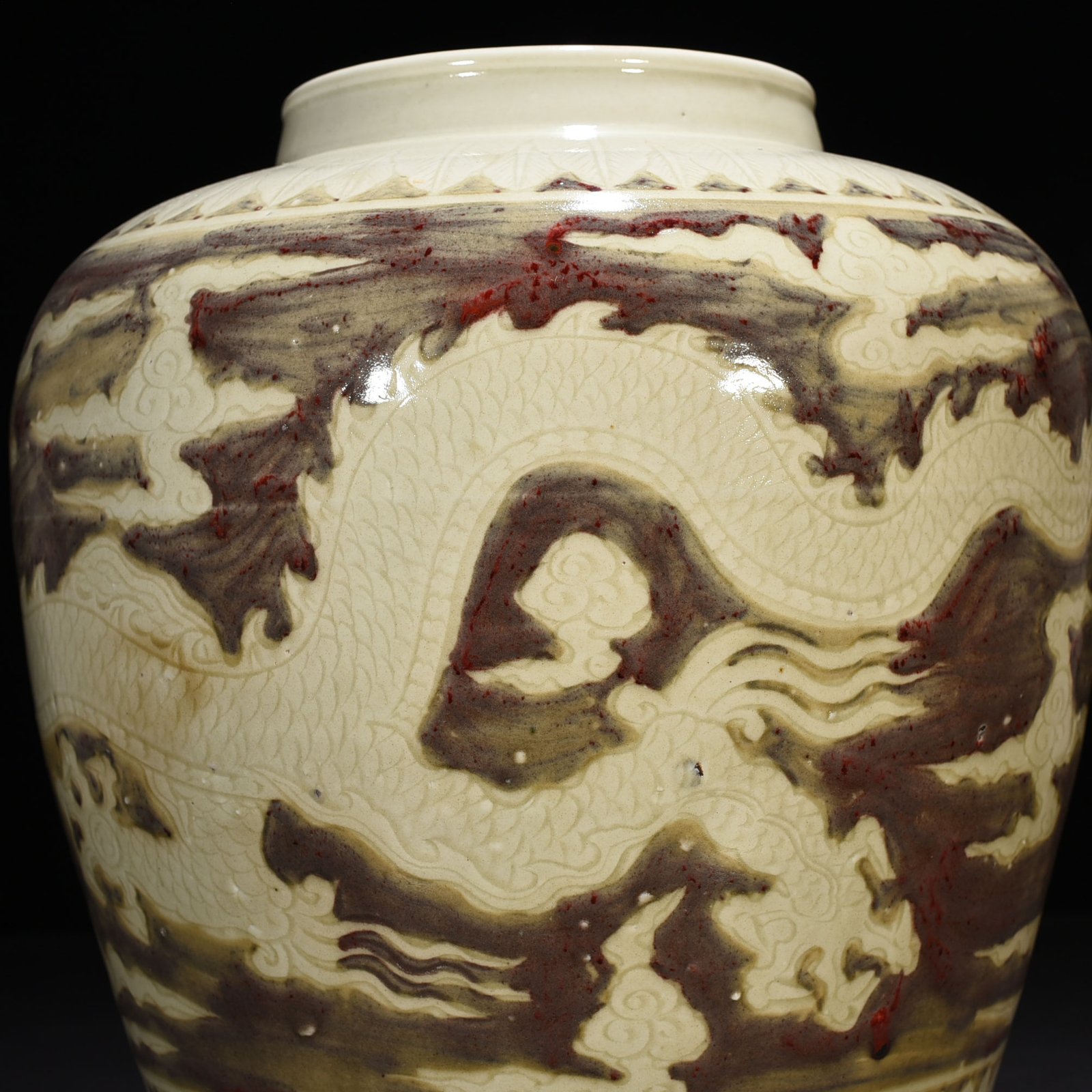 Ming Dynasty Yongle underglaze red carved dragon jar