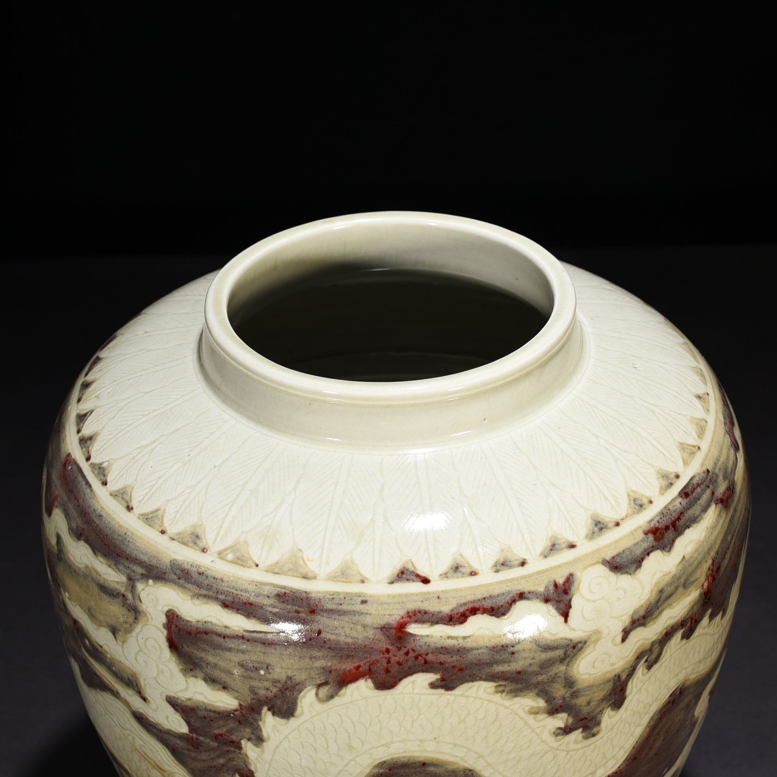 Ming Dynasty Yongle underglaze red carved dragon jar