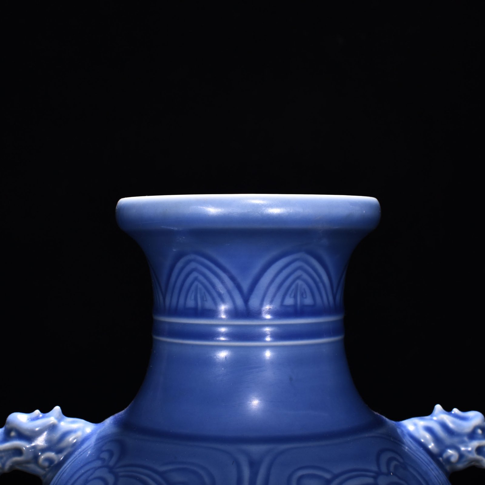 Qing Dynasty Qianlong sky blue glaze phoenix and bird double-eared dish-mouth bottle