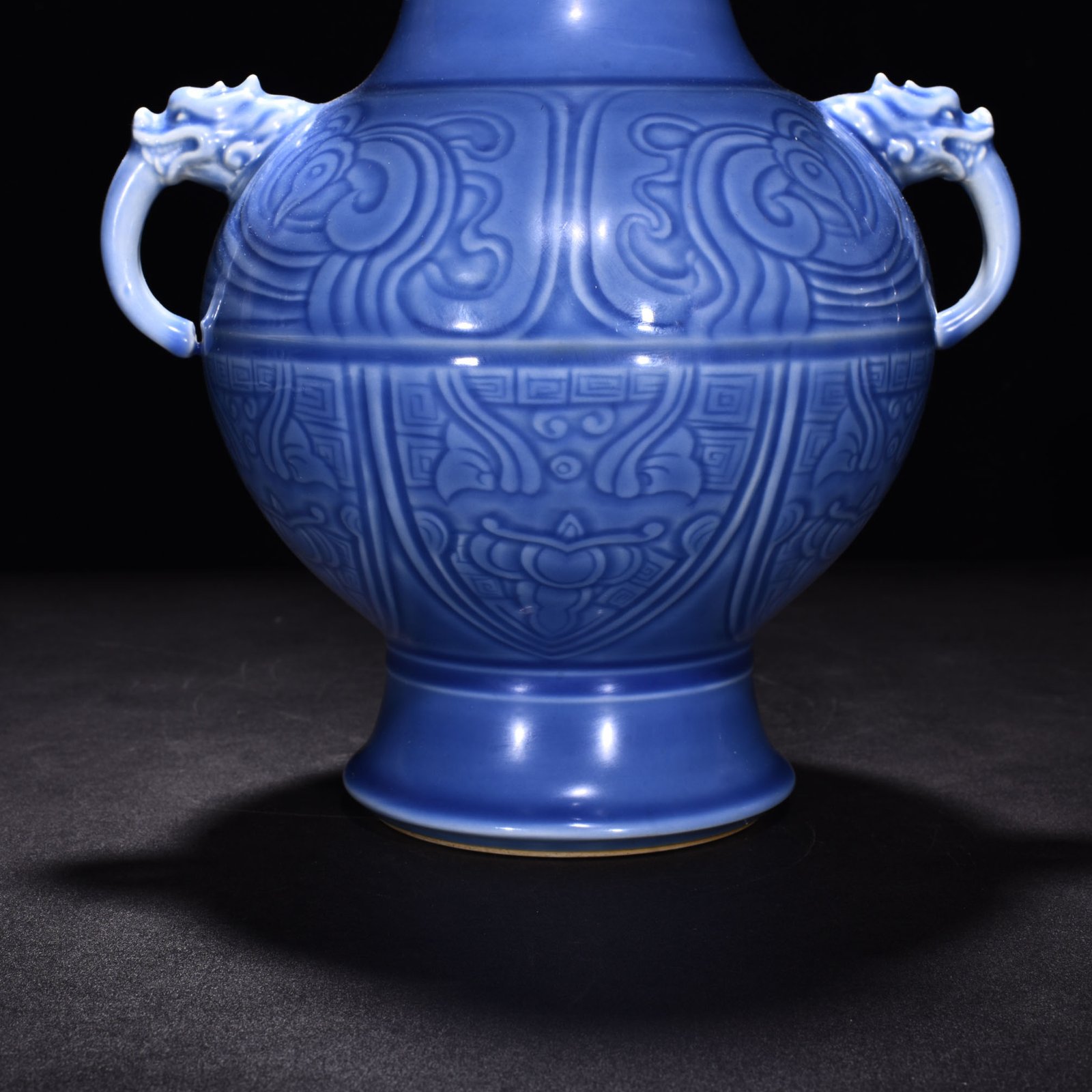 Qing Dynasty Qianlong sky blue glaze phoenix and bird double-eared dish-mouth bottle