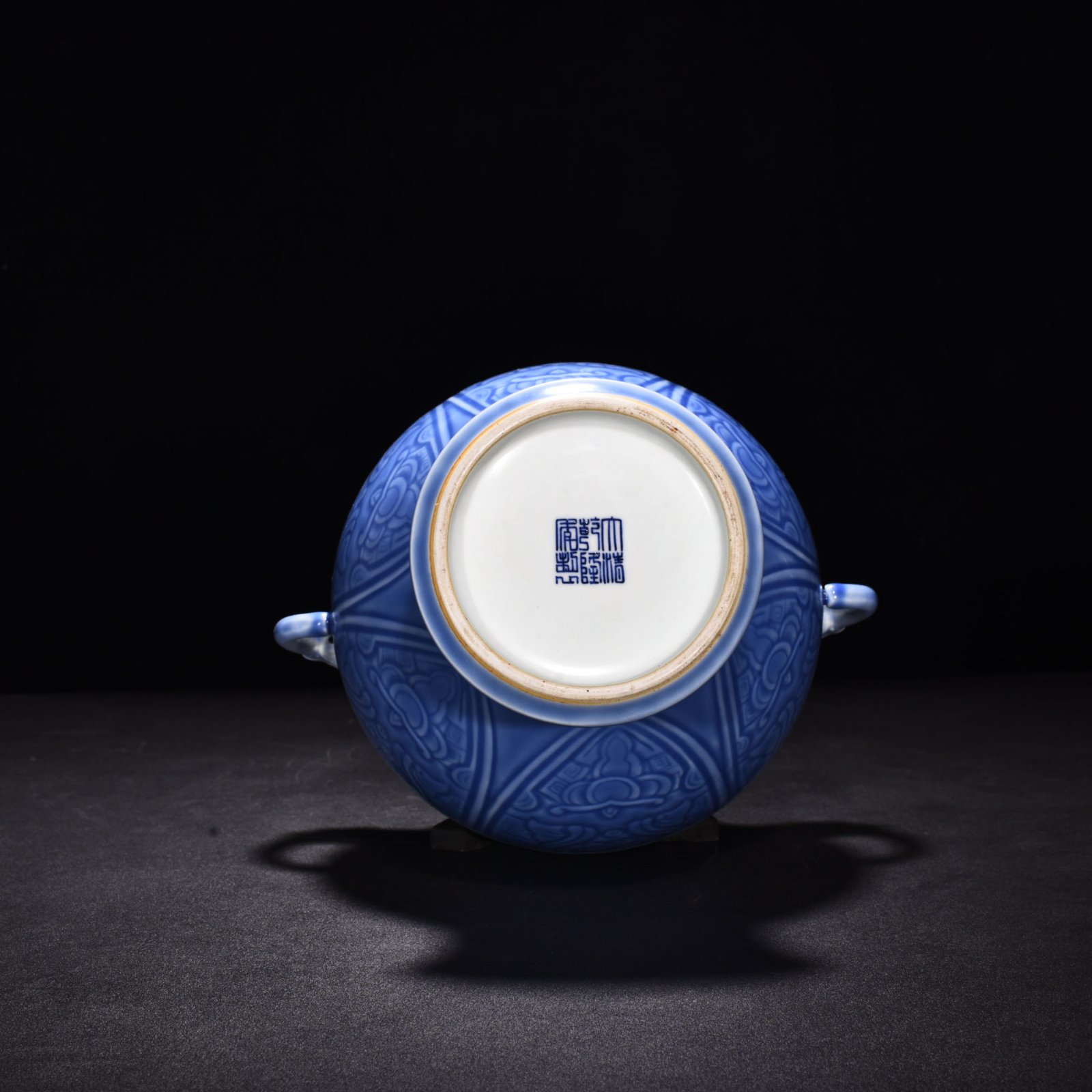 Qing Dynasty Qianlong sky blue glaze phoenix and bird double-eared dish-mouth bottle