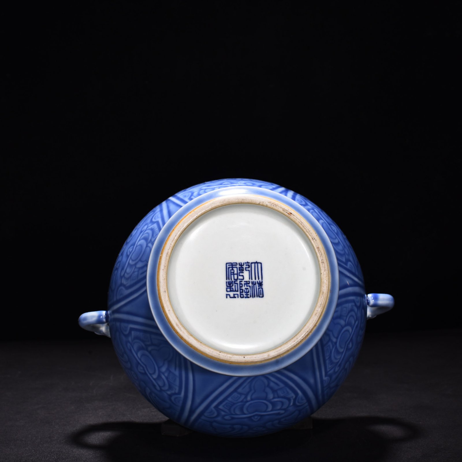 Qing Dynasty Qianlong sky blue glaze phoenix and bird double-eared dish-mouth bottle