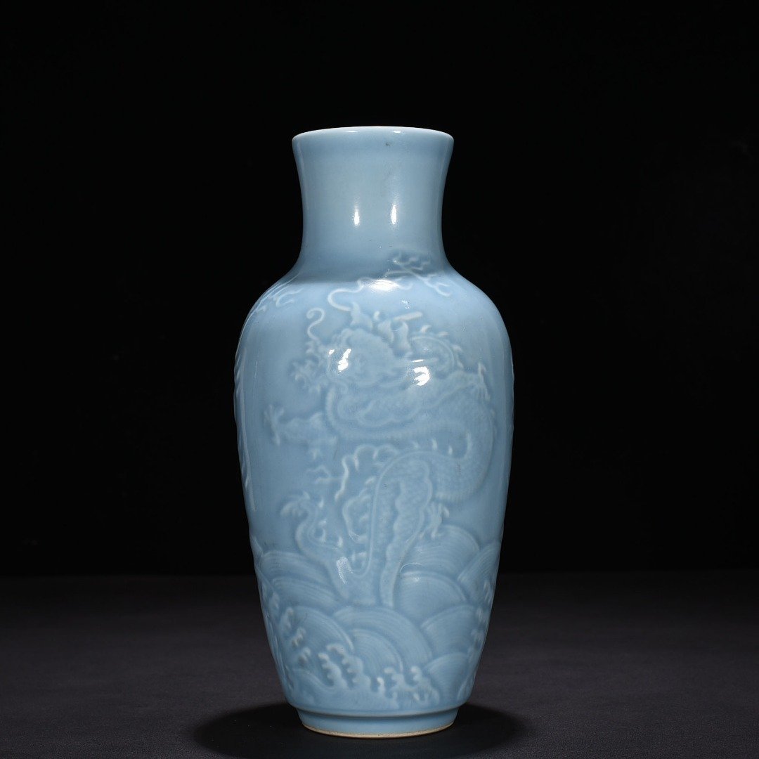 Qing Dynasty Qianlong sky blue glaze engraved dragon vase