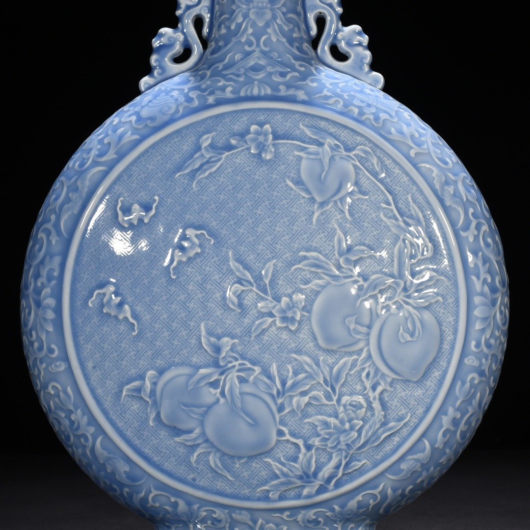 Qing Dynasty Qianlong sky blue glaze carved blessing longevity and many children vase