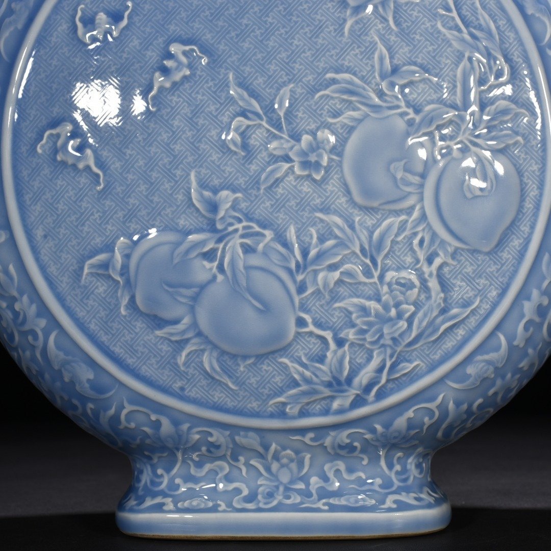 Qing Dynasty Qianlong sky blue glaze carved blessing longevity and many children vase