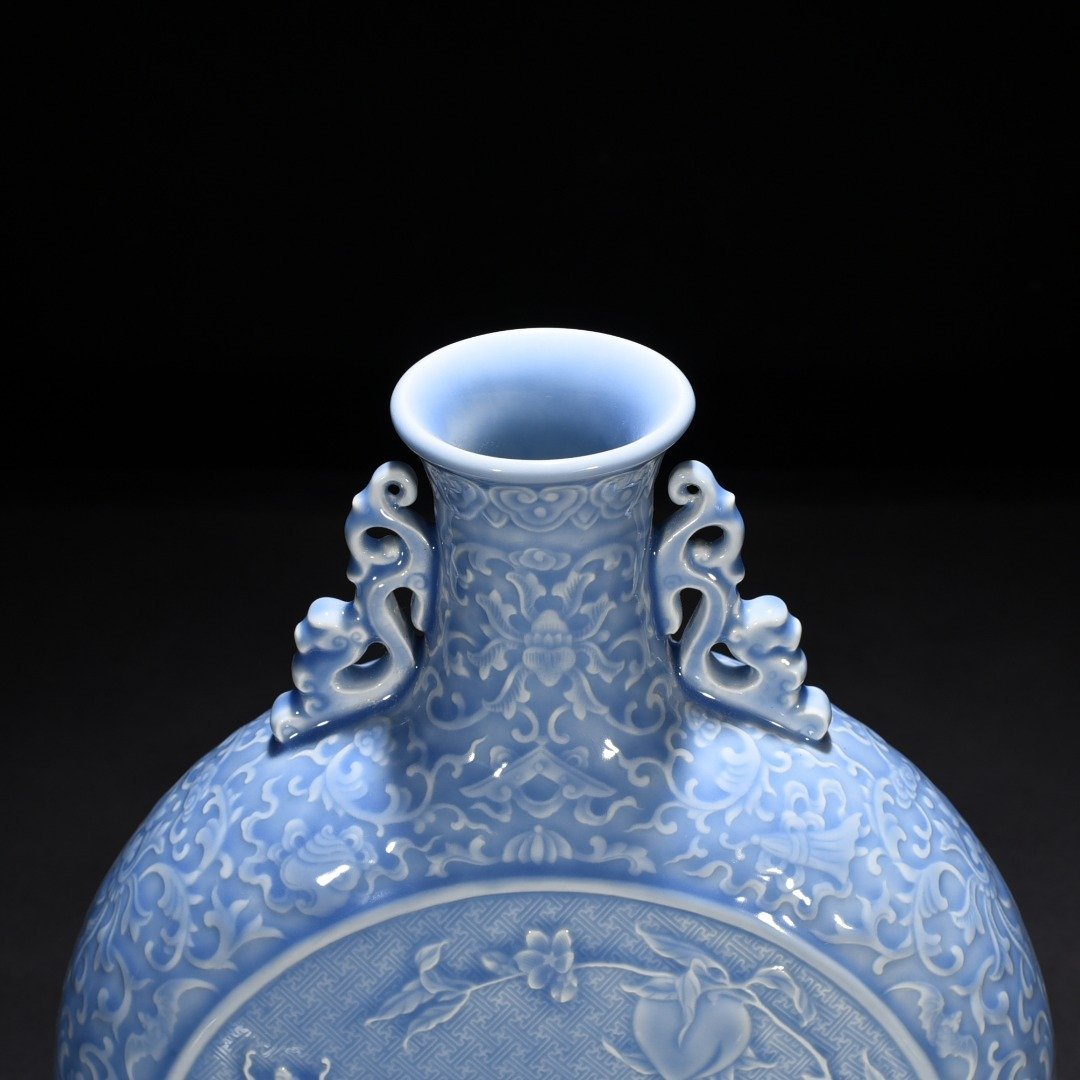 Qing Dynasty Qianlong sky blue glaze carved blessing longevity and many children vase