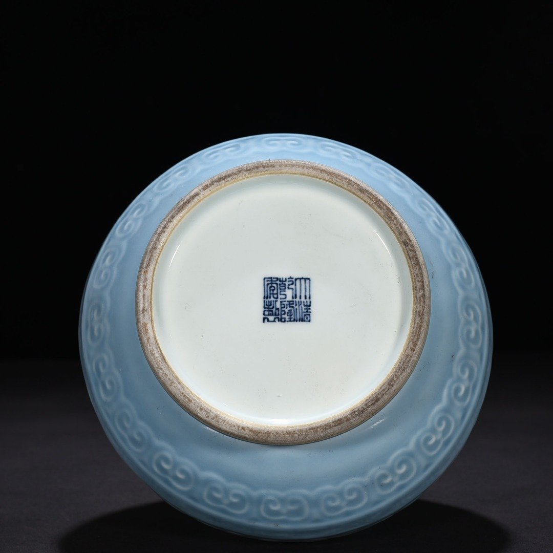 Qing Dynasty Qianlong sky blue glaze carved Taotie jade pot spring vase