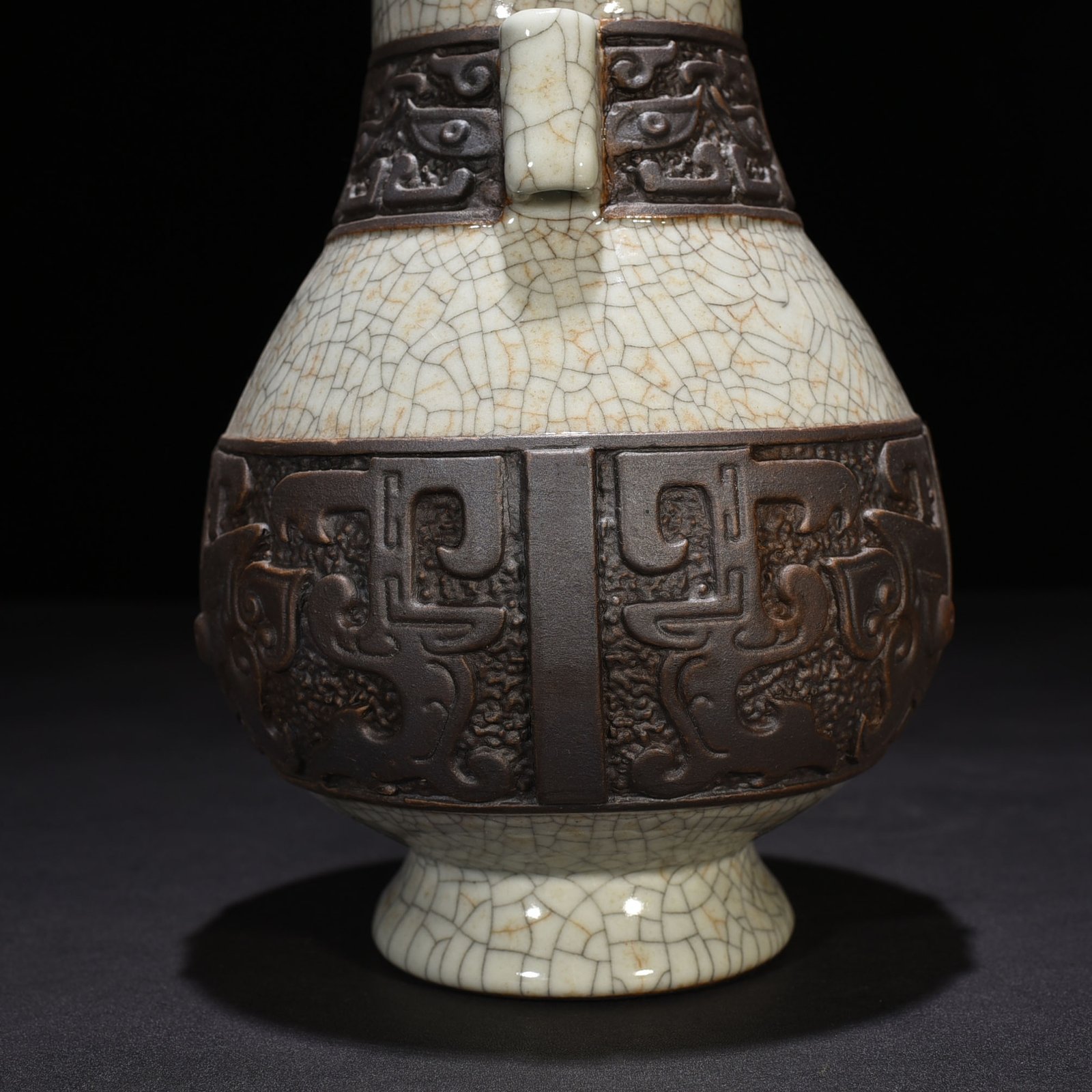Qing Dynasty Qianlong official kiln carved Taotie through-ear vase