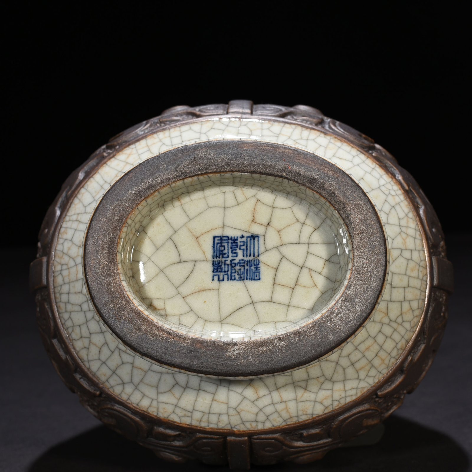 Qing Dynasty Qianlong official kiln carved Taotie through-ear vase