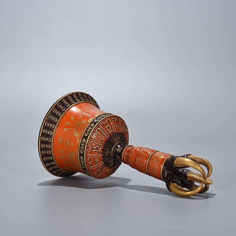 Qing Dynasty Qianlong Sanskrit rattles carved with gold on alum red ground