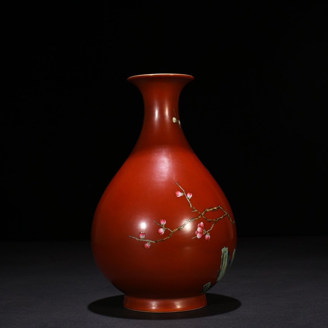 Qing Dynasty Qianlong alum red ground pastel plum jade pot spring vase