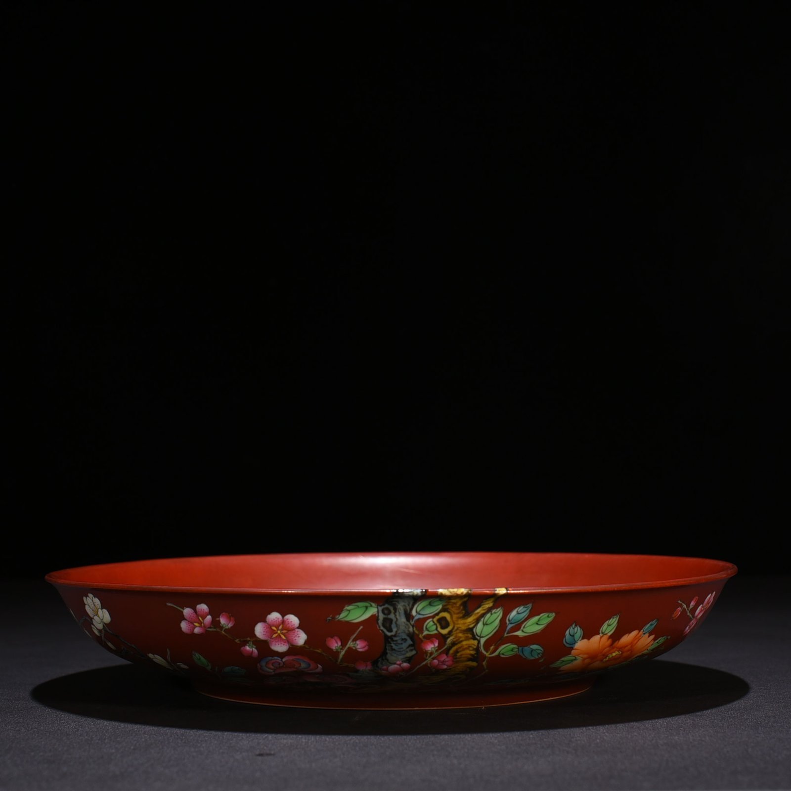 Qing Dynasty Qianlong alum red ground pastel flower plate
