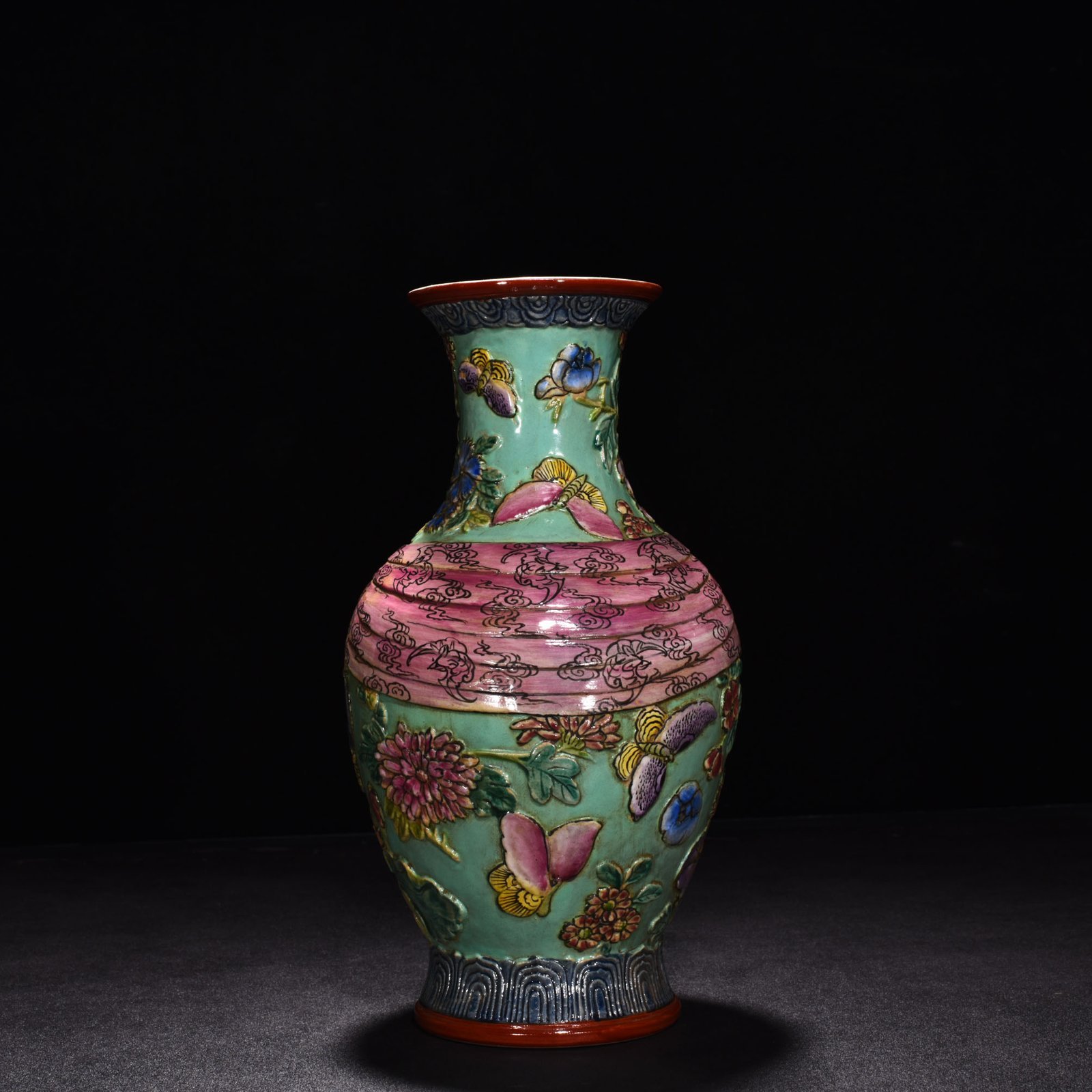 Qing Dynasty Qianlong pastel carved butterfly love and flower baggage vase