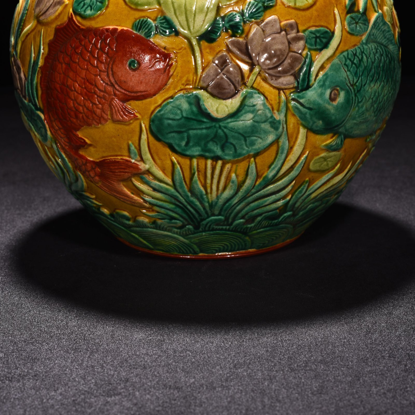 Qing Dynasty Qianlong pastel carved fish and algae lid jar