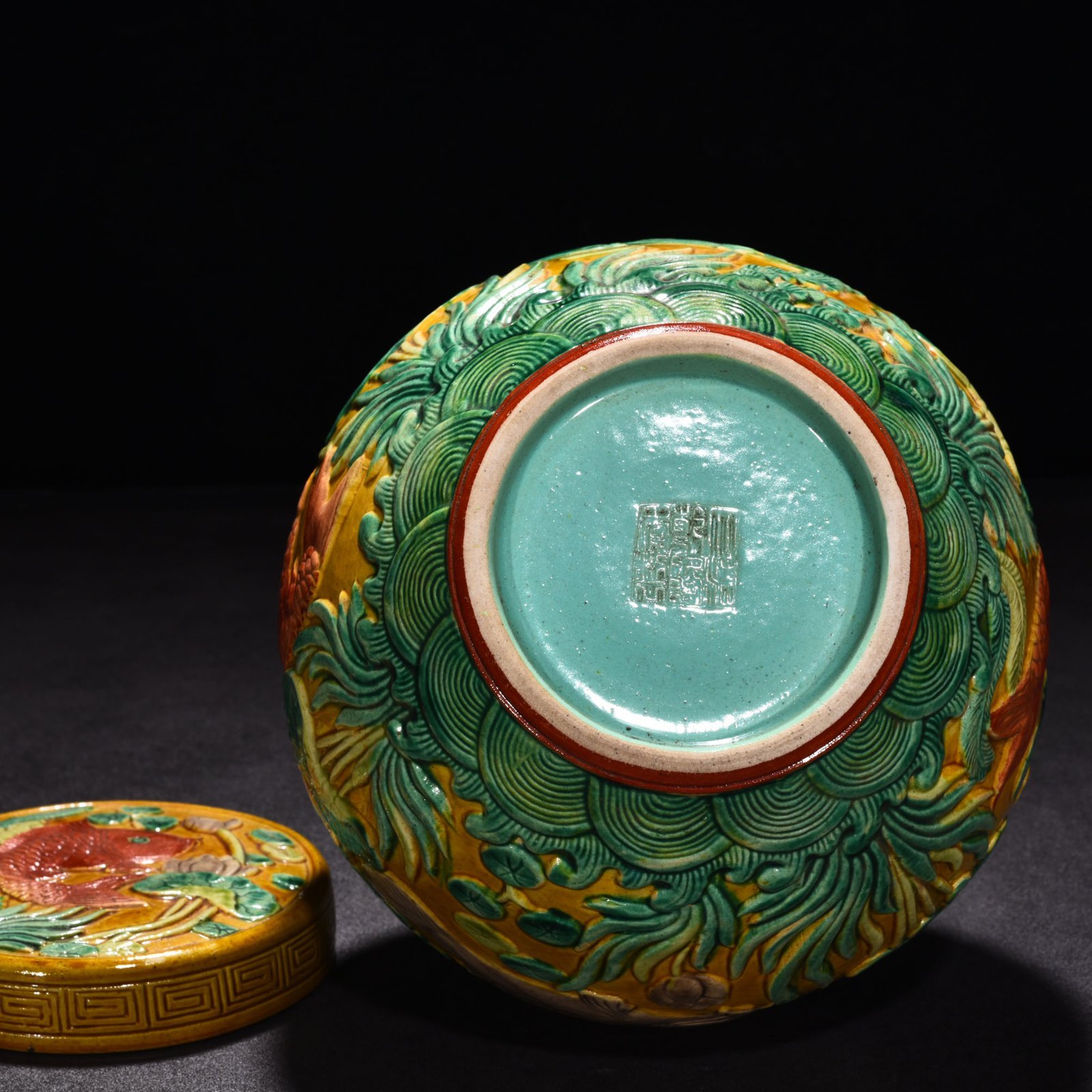 Qing Dynasty Qianlong pastel carved fish and algae lid jar