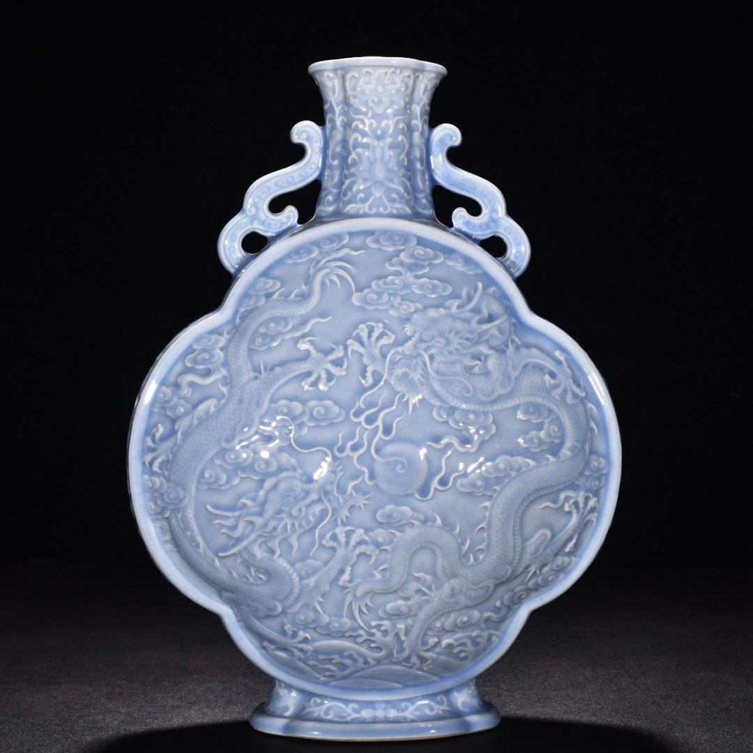 Qing Dynasty Qianlong pink celadon glaze flat bottle with carved double dragons