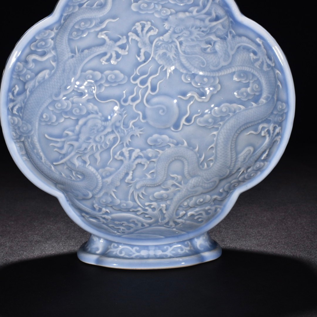 Qing Dynasty Qianlong pink celadon glaze flat bottle with carved double dragons