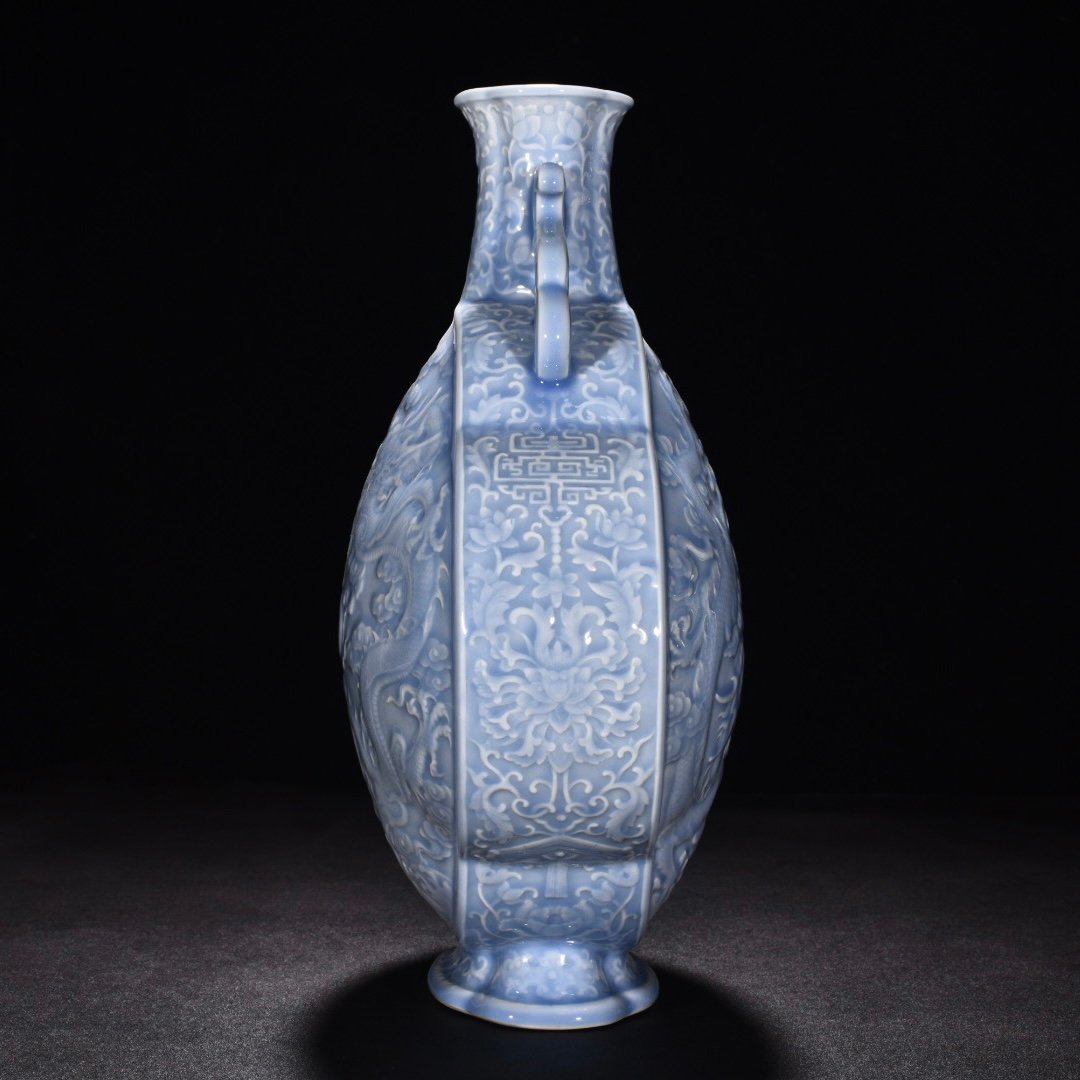 Qing Dynasty Qianlong pink celadon glaze flat bottle with carved double dragons