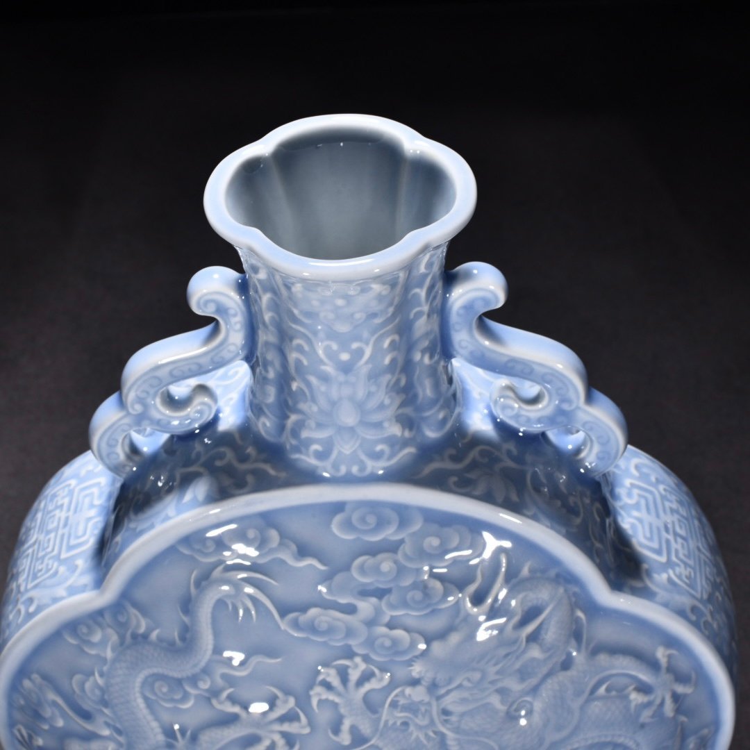 Qing Dynasty Qianlong pink celadon glaze flat bottle with carved double dragons