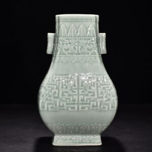 Qing Dynasty Qianlong pink celadon glaze carved Kui dragon through the ear vase