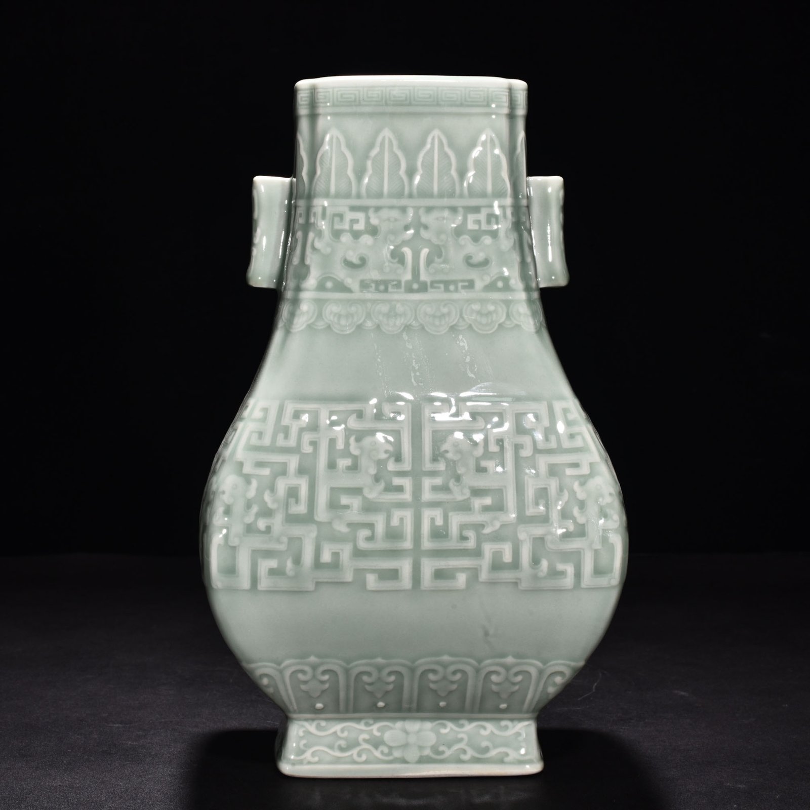 Qing Dynasty Qianlong pink celadon glaze carved Kui dragon through the ear vase