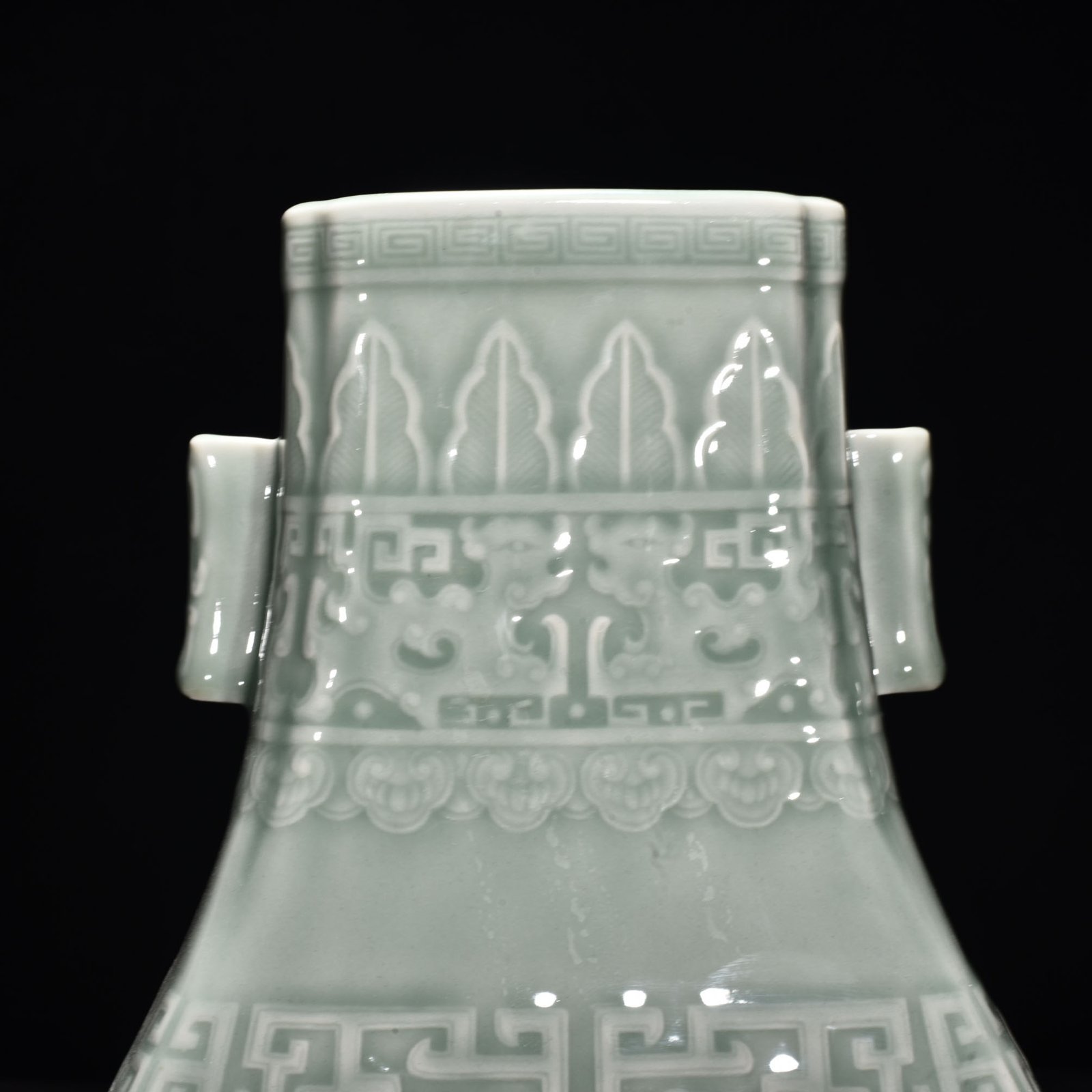 Qing Dynasty Qianlong pink celadon glaze carved Kui dragon through the ear vase