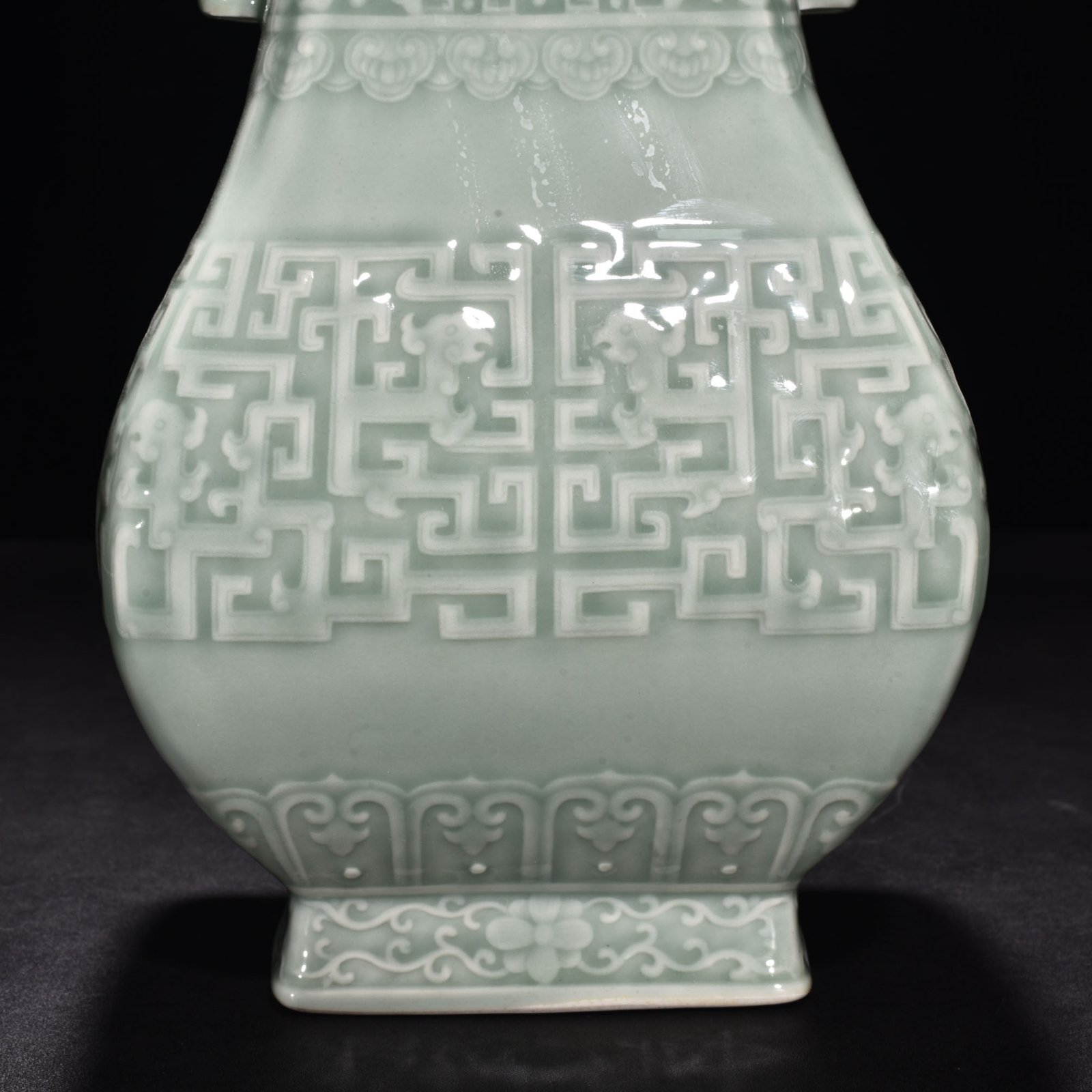 Qing Dynasty Qianlong pink celadon glaze carved Kui dragon through the ear vase