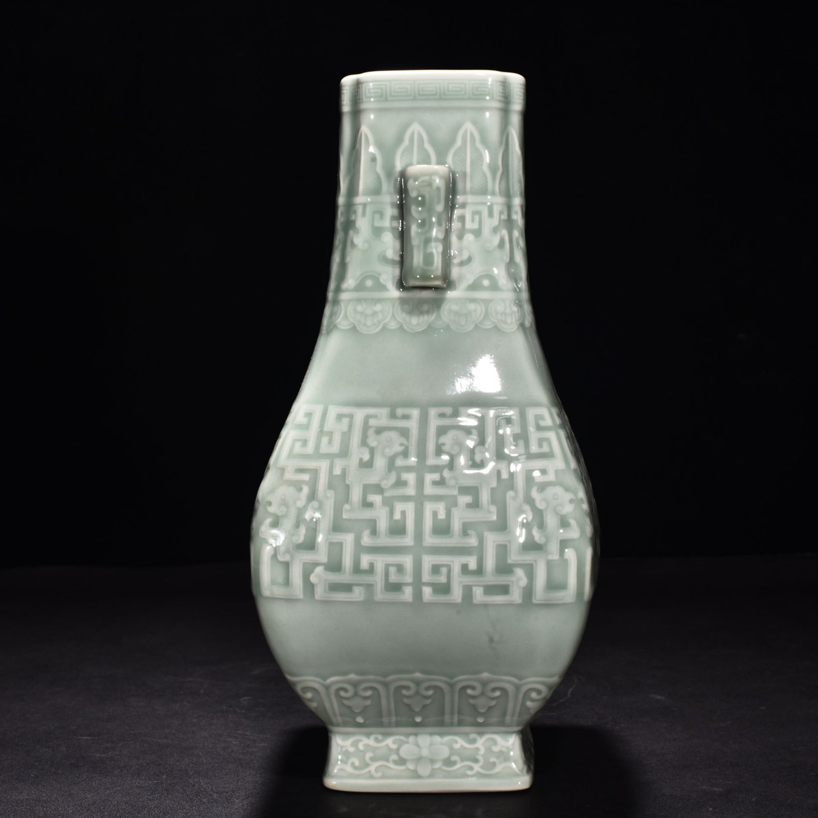 Qing Dynasty Qianlong pink celadon glaze carved Kui dragon through the ear vase