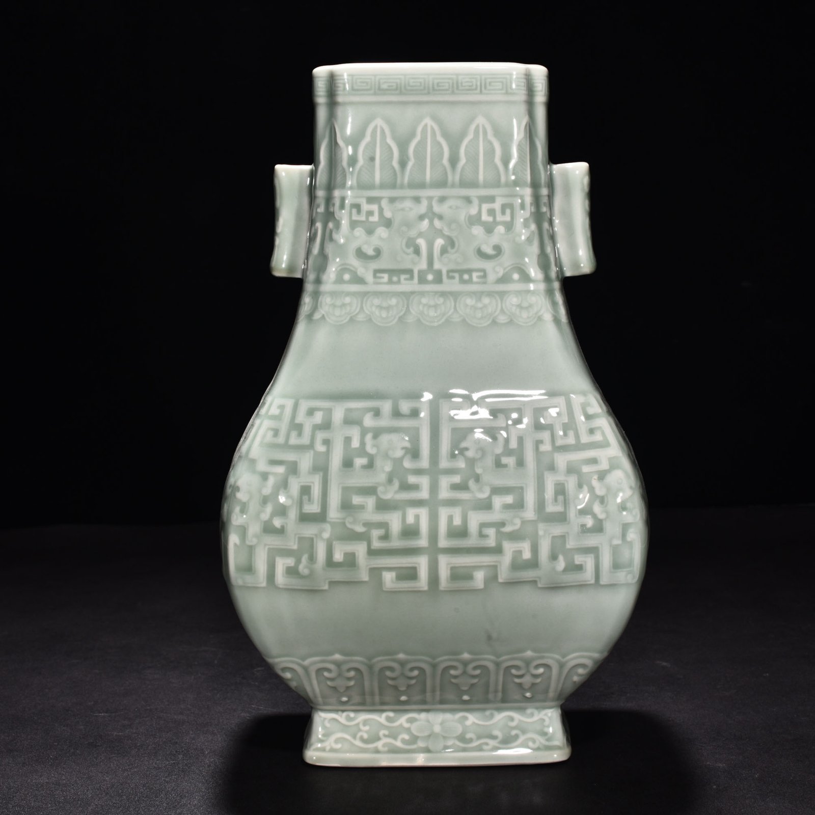 Qing Dynasty Qianlong pink celadon glaze carved Kui dragon through the ear vase
