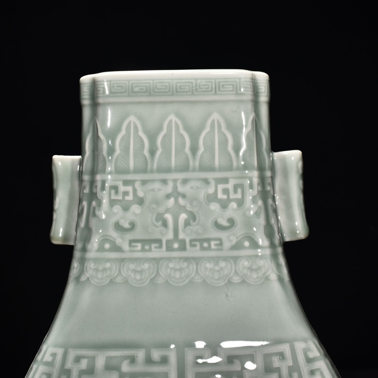 Qing Dynasty Qianlong pink celadon glaze carved Kui dragon through the ear vase