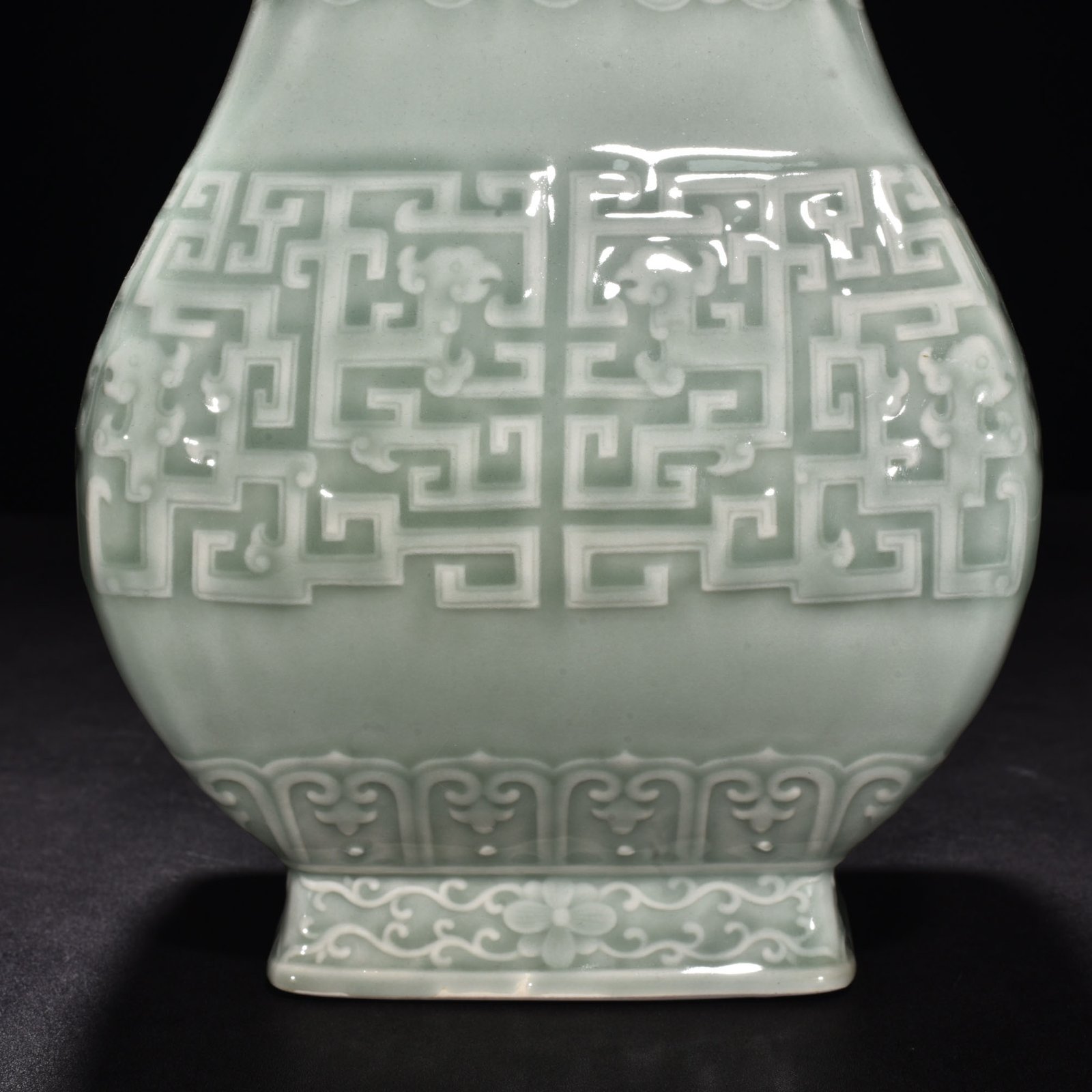 Qing Dynasty Qianlong pink celadon glaze carved Kui dragon through the ear vase